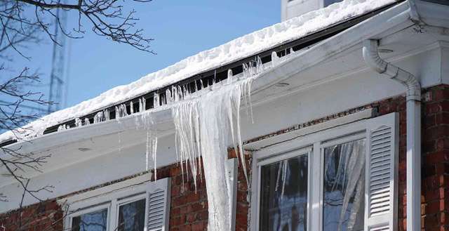 Ice Dams Damage Your Roof in Winter. C.L. Frey Construction roofers have solutions.